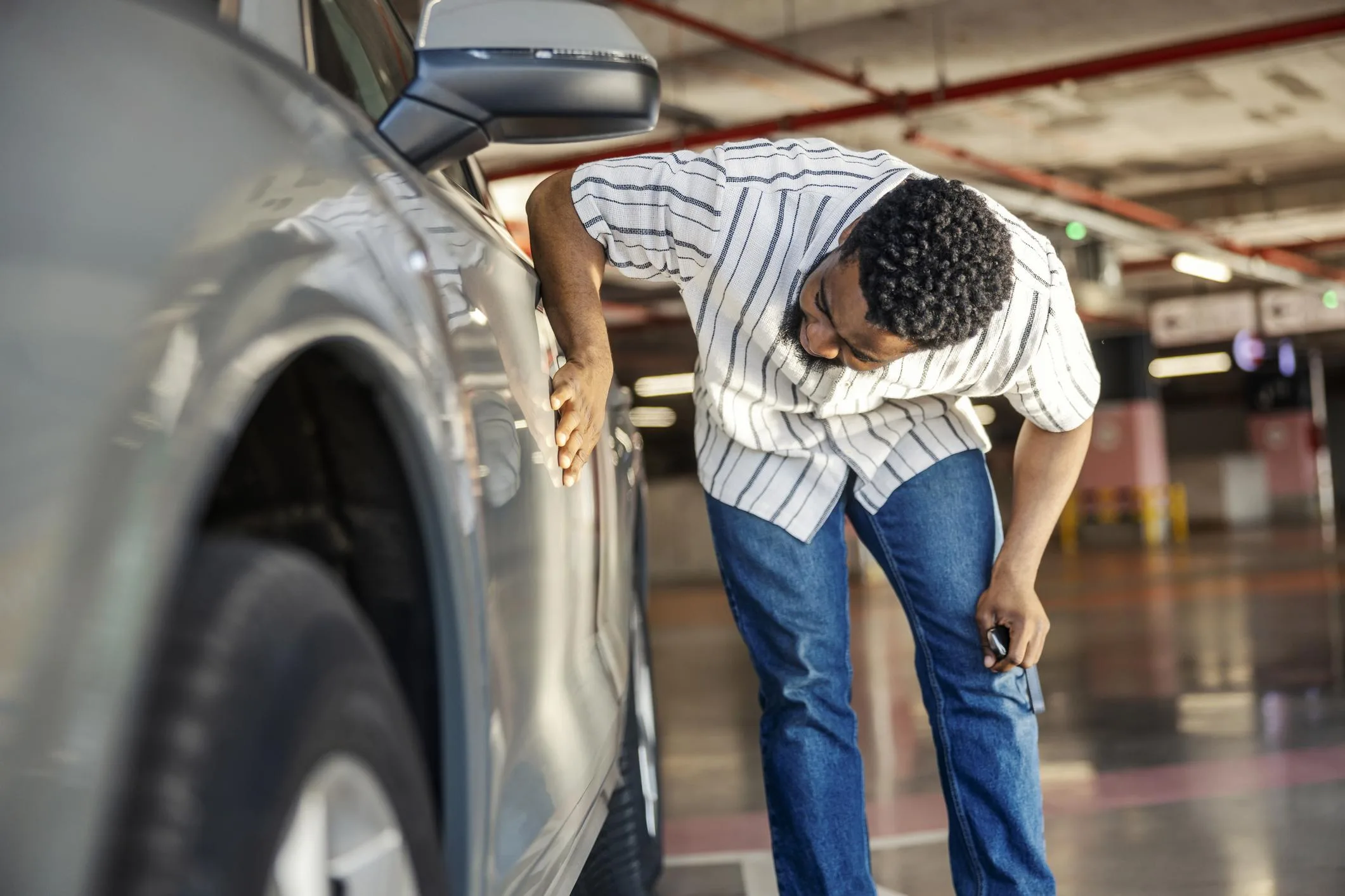 Buyer inspecting a vehicle at pickup
