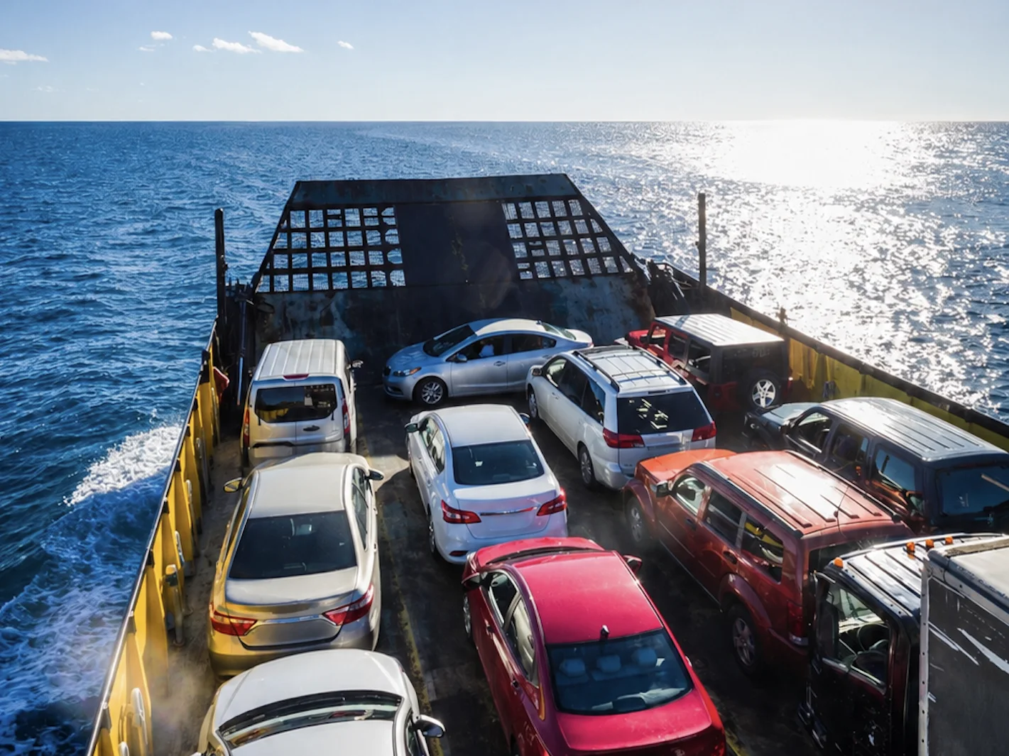 Vehicles loaded aboard a ferry, ready to travel island to island